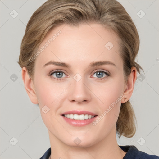 Joyful white young-adult female with medium  brown hair and blue eyes