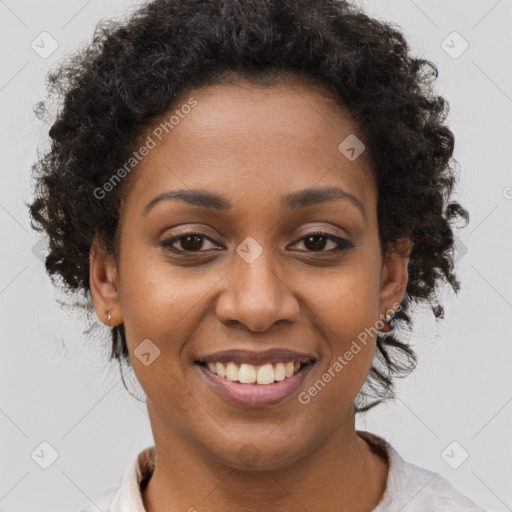 Joyful black young-adult female with short  brown hair and brown eyes