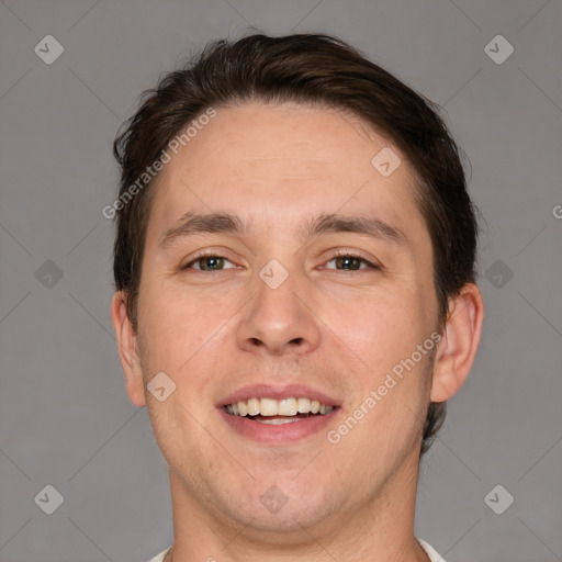 Joyful white adult male with short  brown hair and brown eyes