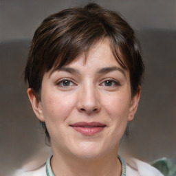 Joyful white adult female with short  brown hair and brown eyes