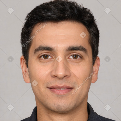 Joyful white young-adult male with short  black hair and brown eyes