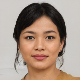 Joyful asian young-adult female with medium  black hair and brown eyes