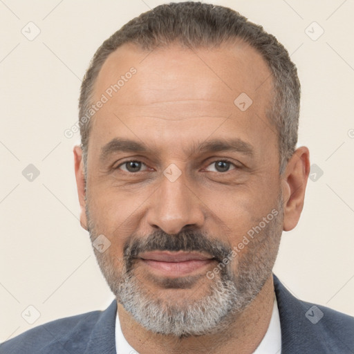 Joyful white adult male with short  black hair and brown eyes