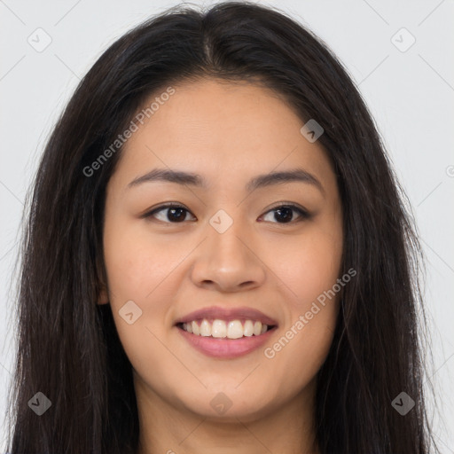 Joyful asian young-adult female with long  brown hair and brown eyes