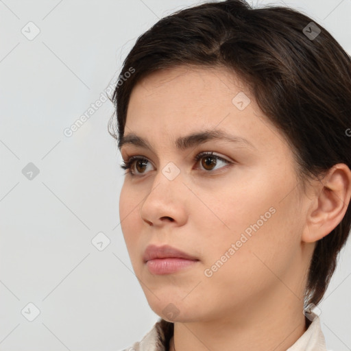 Neutral white young-adult female with short  brown hair and brown eyes