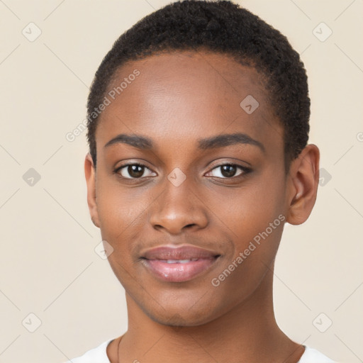 Joyful black young-adult female with short  brown hair and brown eyes