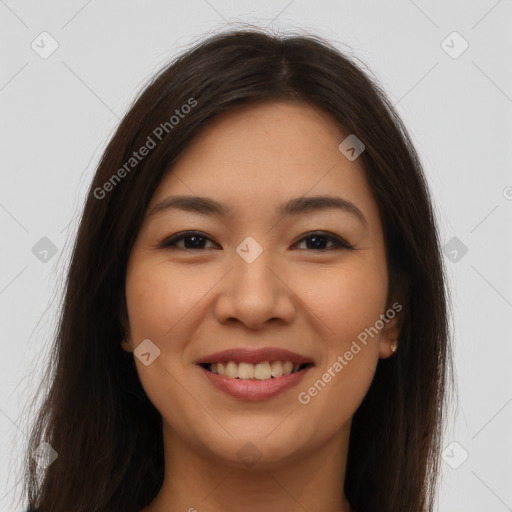 Joyful latino young-adult female with long  brown hair and brown eyes