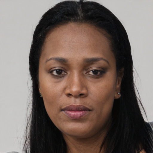 Neutral black adult female with long  black hair and brown eyes