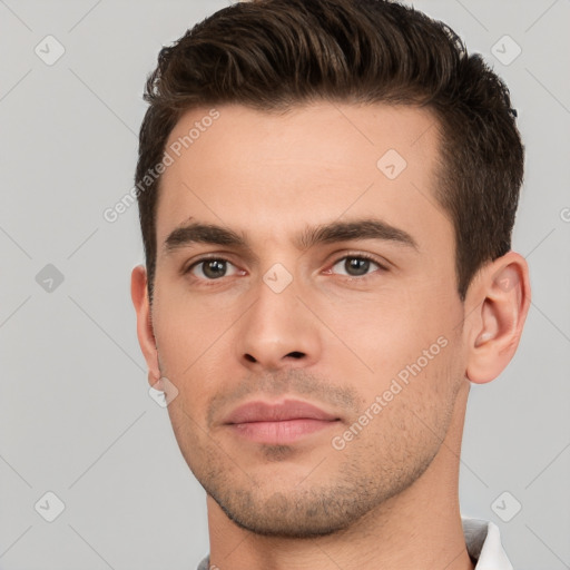 Neutral white young-adult male with short  brown hair and brown eyes