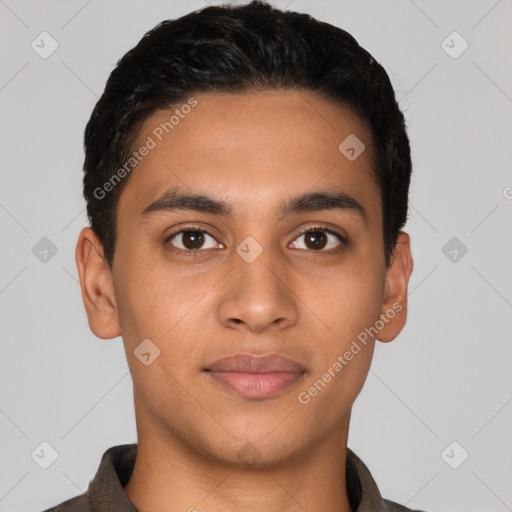 Joyful latino young-adult male with short  black hair and brown eyes