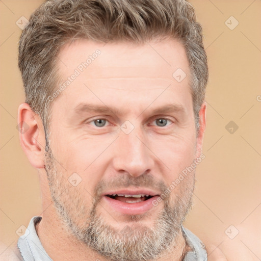 Joyful white adult male with short  brown hair and grey eyes