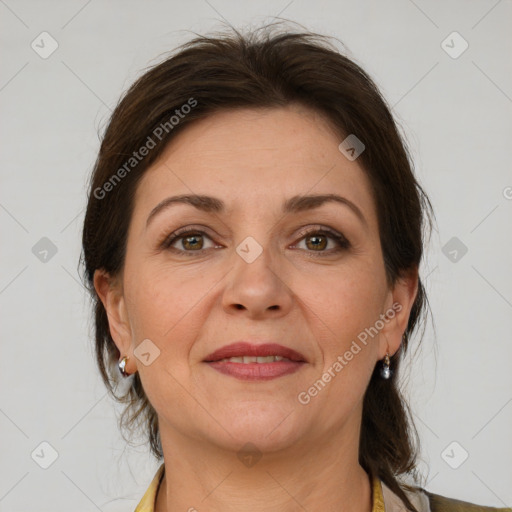 Joyful white adult female with medium  brown hair and grey eyes