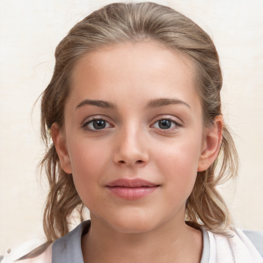 Joyful white child female with medium  brown hair and grey eyes