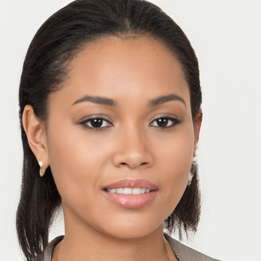 Joyful white young-adult female with long  brown hair and brown eyes