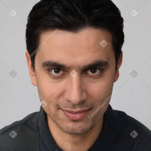 Joyful white young-adult male with short  black hair and brown eyes