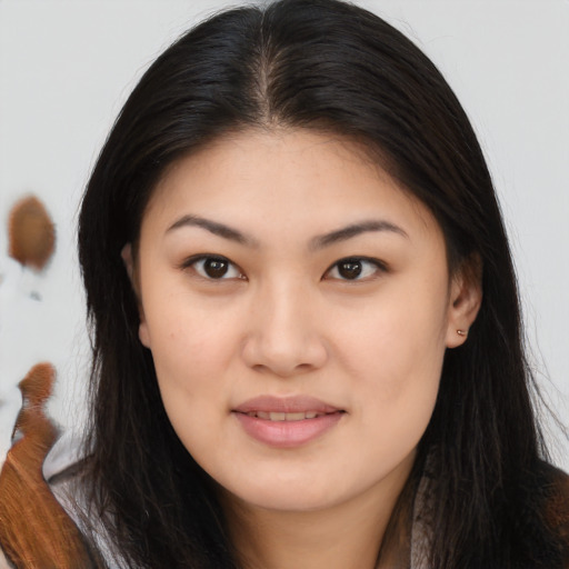 Joyful asian young-adult female with long  brown hair and brown eyes