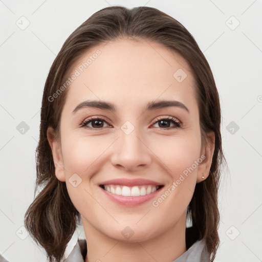 Joyful white young-adult female with medium  brown hair and grey eyes