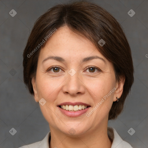 Joyful white adult female with medium  brown hair and brown eyes