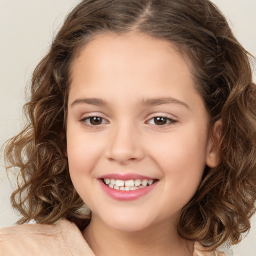 Joyful white child female with medium  brown hair and brown eyes