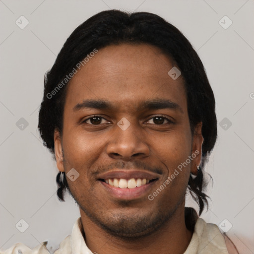 Joyful black young-adult male with short  black hair and brown eyes