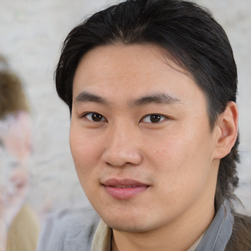 Neutral asian young-adult male with medium  brown hair and brown eyes