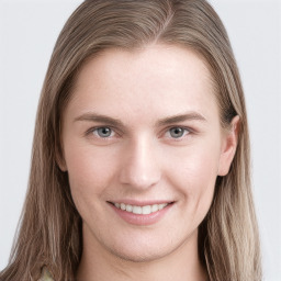 Joyful white young-adult female with long  brown hair and grey eyes