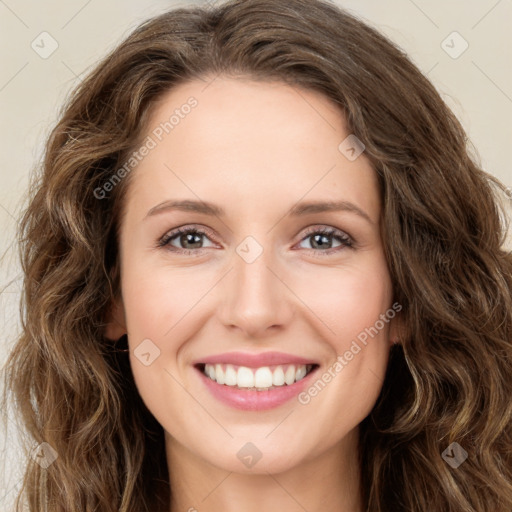 Joyful white young-adult female with long  brown hair and green eyes