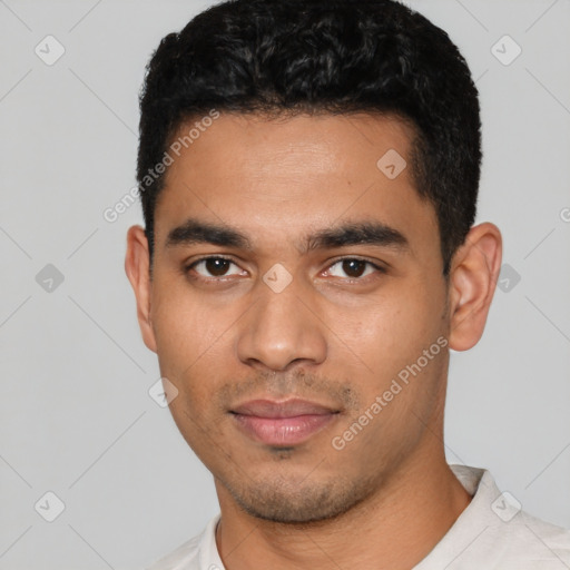 Neutral latino young-adult male with short  black hair and brown eyes
