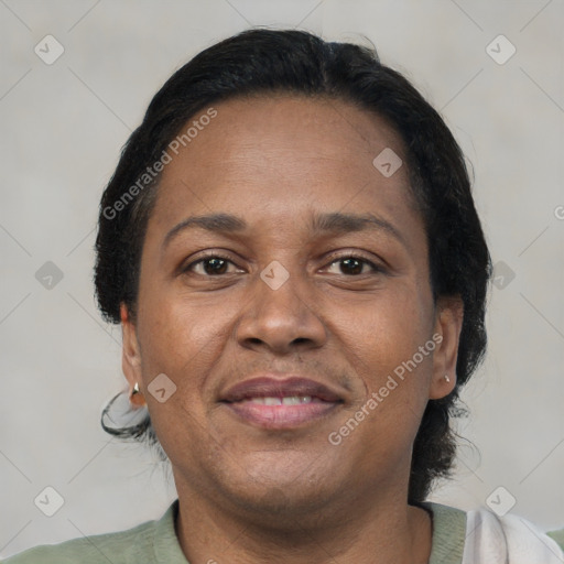 Joyful black adult female with short  brown hair and brown eyes