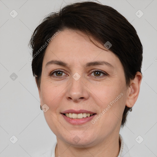 Joyful white adult female with medium  brown hair and brown eyes