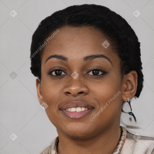 Joyful black young-adult female with short  black hair and brown eyes