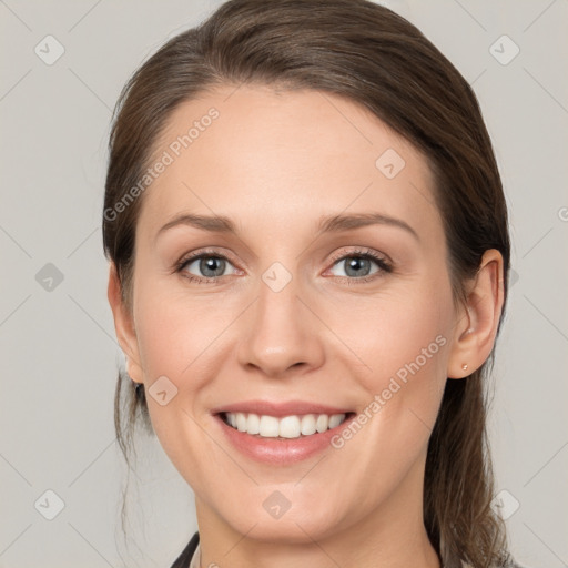 Joyful white young-adult female with medium  brown hair and grey eyes