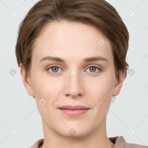 Joyful white young-adult female with short  brown hair and grey eyes