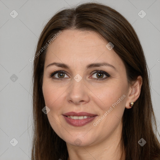 Joyful white adult female with long  brown hair and brown eyes