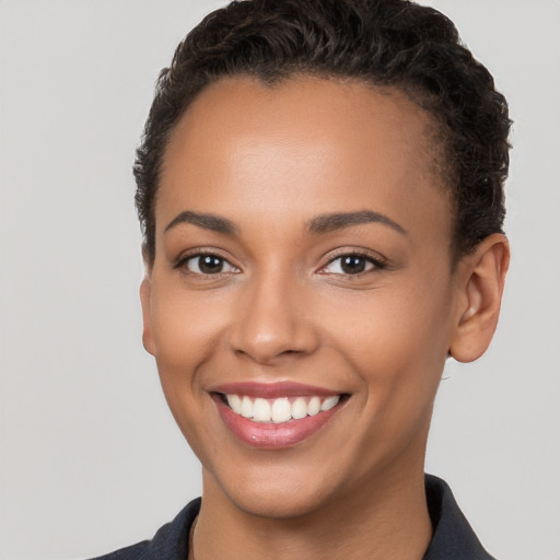 Joyful white young-adult female with short  brown hair and brown eyes