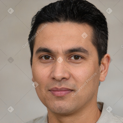 Joyful white young-adult male with short  black hair and brown eyes