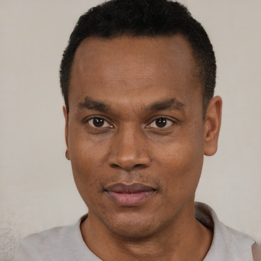 Neutral black adult male with short  black hair and brown eyes