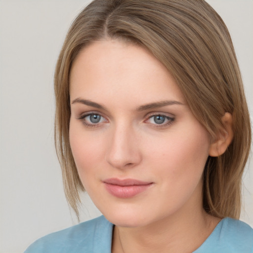 Neutral white young-adult female with medium  brown hair and grey eyes