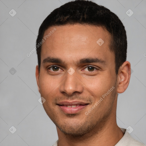 Joyful white young-adult male with short  black hair and brown eyes