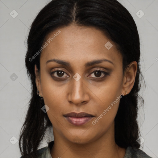 Joyful latino young-adult female with long  brown hair and brown eyes