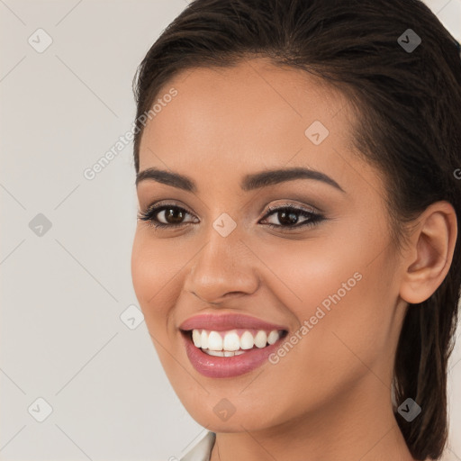 Joyful white young-adult female with long  brown hair and brown eyes