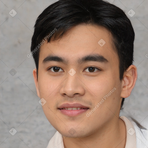 Joyful asian young-adult male with short  brown hair and brown eyes