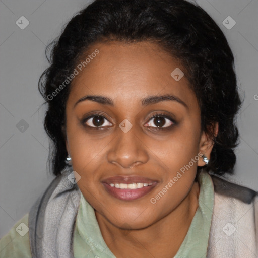 Joyful black young-adult female with long  black hair and brown eyes