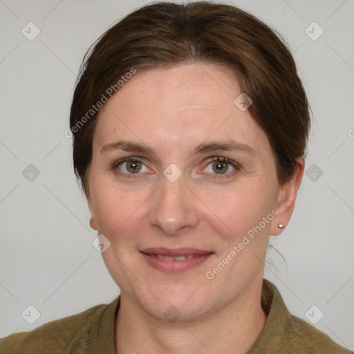 Joyful white adult female with medium  brown hair and grey eyes