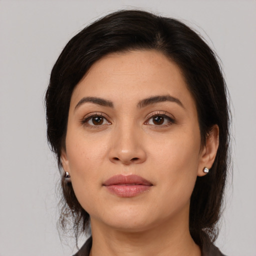 Joyful white young-adult female with medium  brown hair and brown eyes