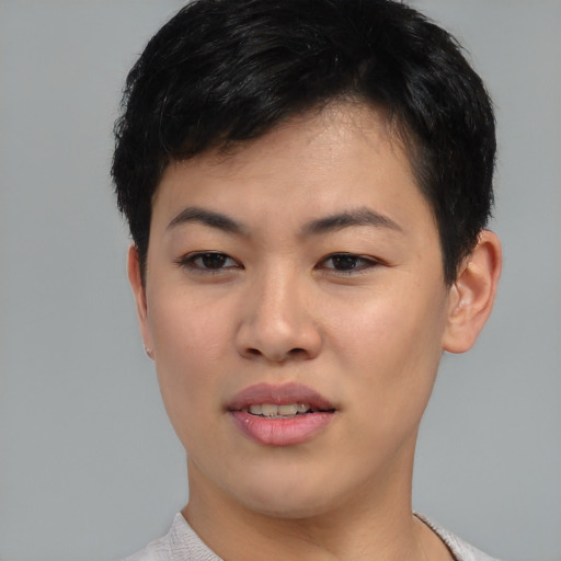 Joyful asian young-adult female with short  brown hair and brown eyes