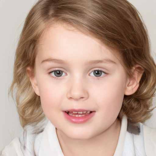 Joyful white child female with medium  brown hair and brown eyes