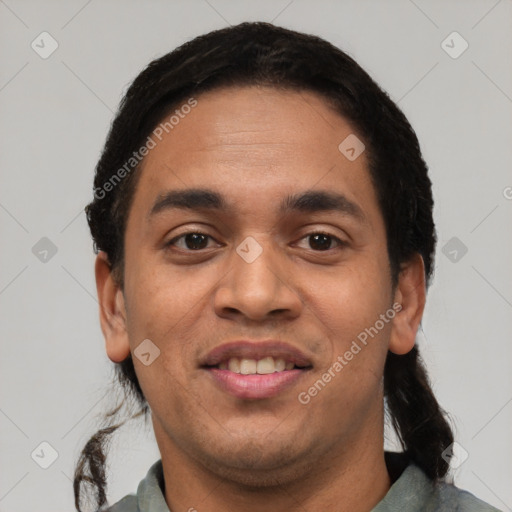 Joyful white young-adult male with short  black hair and brown eyes