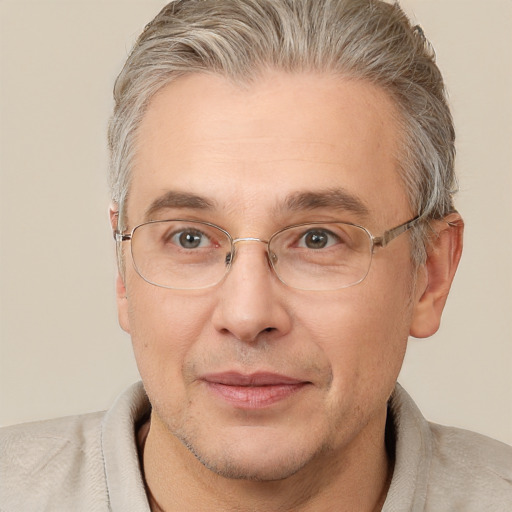 Joyful white middle-aged male with short  brown hair and brown eyes