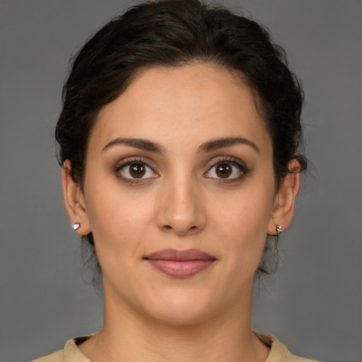 Joyful white young-adult female with medium  brown hair and brown eyes